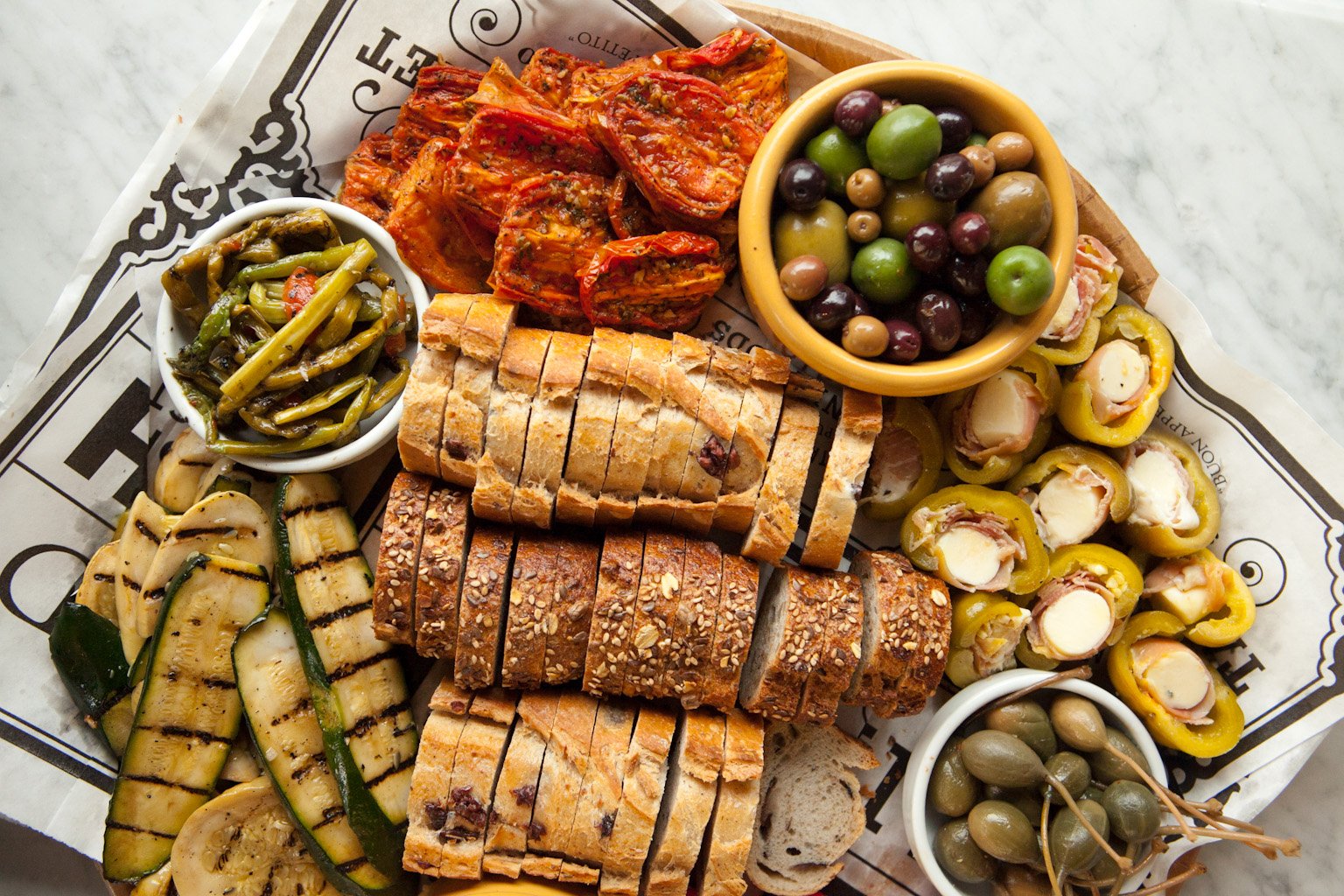 Bread, vegetables, olives platter